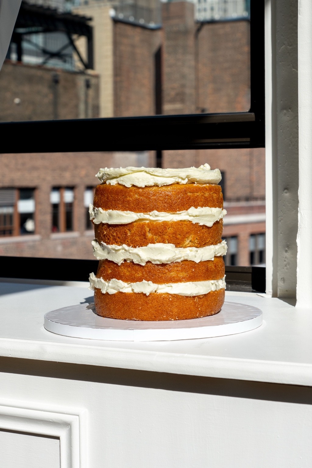 Four-layer vanilla naked cake